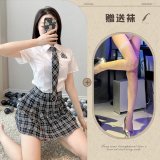 Top + skirt + tie + white fishnet stockings