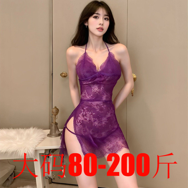 Woman modeling a purple plus size lace bodysuit with sheer mesh, cut-outs, and adjustable ties, designed for a busty fit up t...