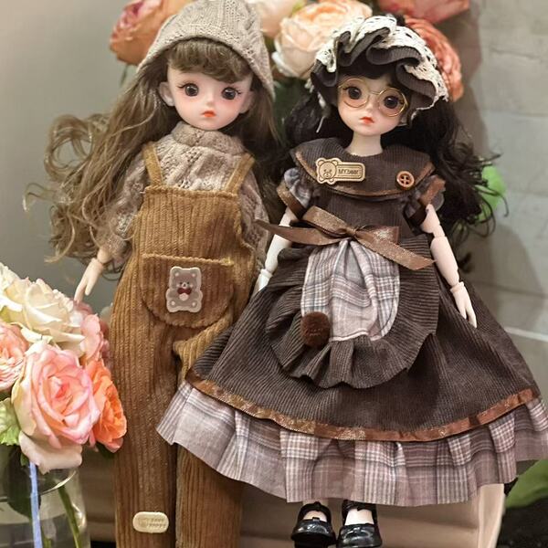 Two adorable bjd dolls dressed in charming outfits, perfect for princess-themed dress-up play and collection. ideal for girls...