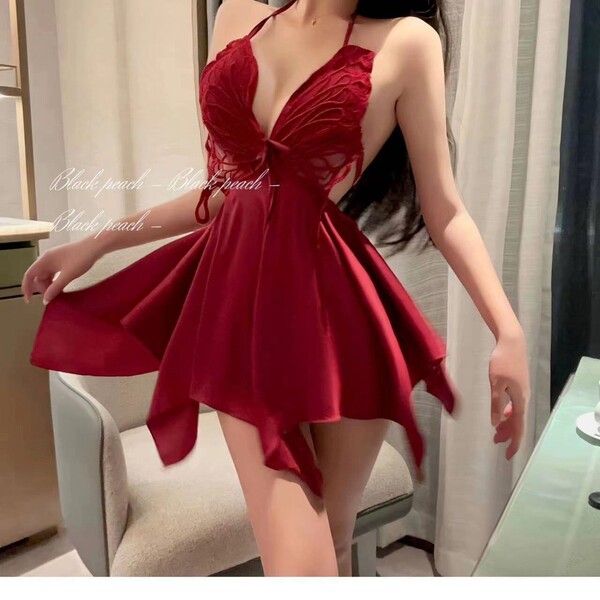 Woman wearing red butterfly lace sleeveless sleep dress with sheer back, bow detail, and flowing skirt for romantic spring li...