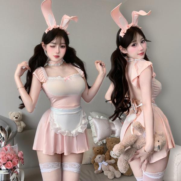 Pink bunny maid costume with lace trim, sheer mesh bodice, white apron, and matching ears. adjustable straps for a snug fit.