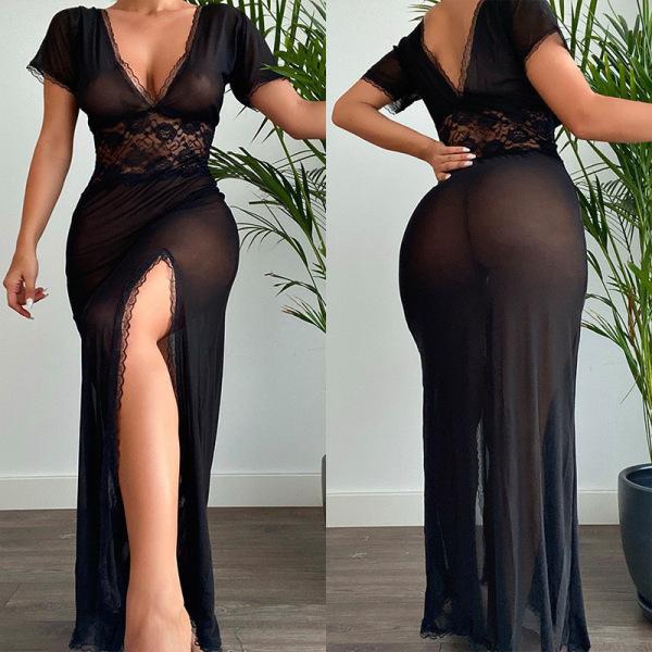 Woman wearing a sexy black lace mesh slit long dress, showcasing its sheer fabric and elegant design for nightclub or lingeri...
