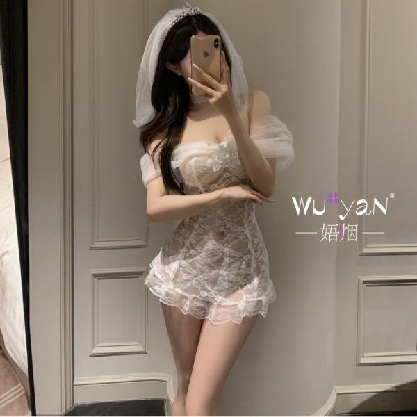 Woman in mirror wearing white lace bridal lingerie set with veil, modest yet sexy design for sleepwear or cosplay.