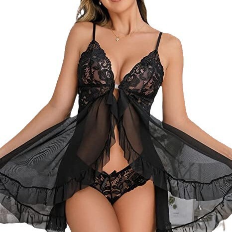 Woman wearing black sheer mesh lace chemise with matching lingerie set, romantic nightwear collection.