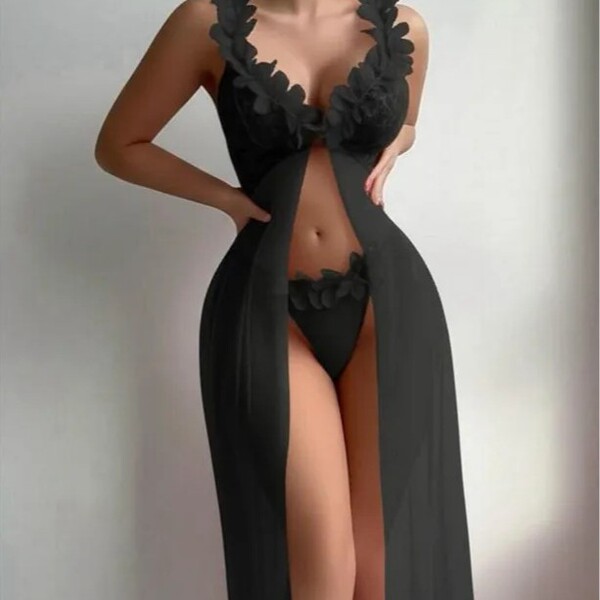 Elegant black sheer lace low-back slip dress with sensual mesh design, perfect for women seeking luxurious and feminine linge...