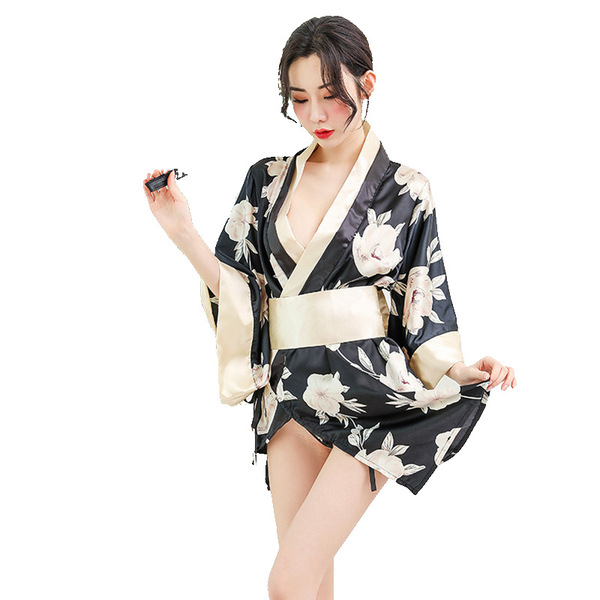 A woman models a black floral print robe with gold accents, featuring a tied waistband and elegant design, perfect for romant...