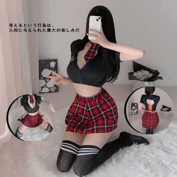 Woman modeling sexy jk style lingerie set with red plaid skirt, black crop top, and thigh-high socks in a cozy room setting.