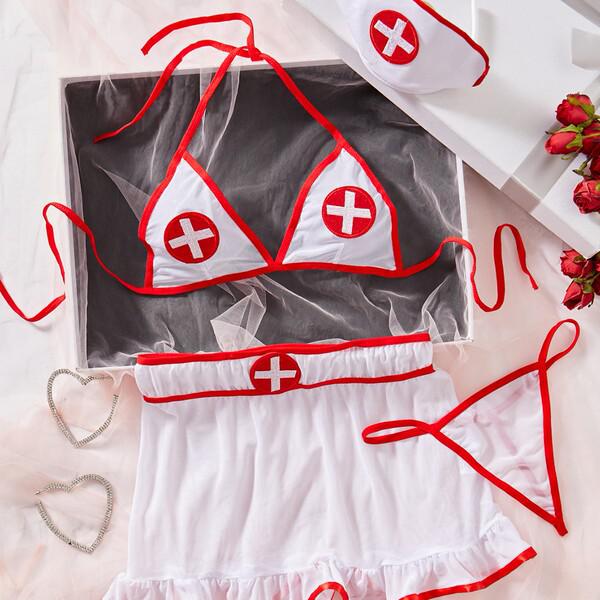 White nurse lingerie set with red trim, sheer top, shorts, and hat. seductive role play outfit with lace details.