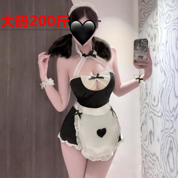Woman wearing black and white plus size maid costume lingerie set with apron, heart detail, and open-crotch design for adult ...
