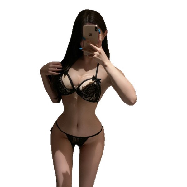 Woman taking selfie in black lace lingerie set, featuring a bra and thong from the pure & playful seductive 3-piece sleepwear...