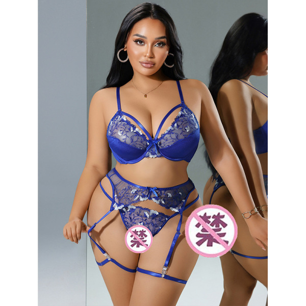 Woman modeling blue qimengya lace thong set with thigh rings, featuring sheer panels and adjustable straps for a seductive lo...