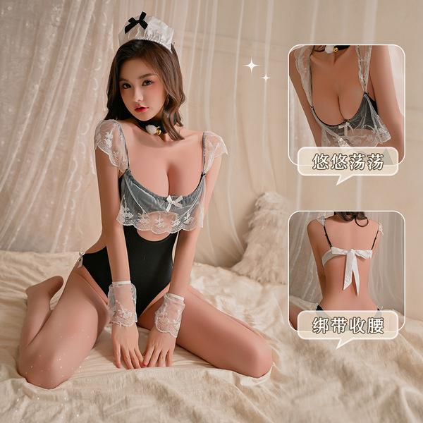 Model wearing yuedie lace ruffled chef & maid costume - sexy tight-fit bodysuit with corset-style shaping, kneeling on bed.