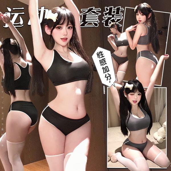 Model wearing black lace trim crop top and high-waisted shorts set, sporty chic outfit with bold contrast details.