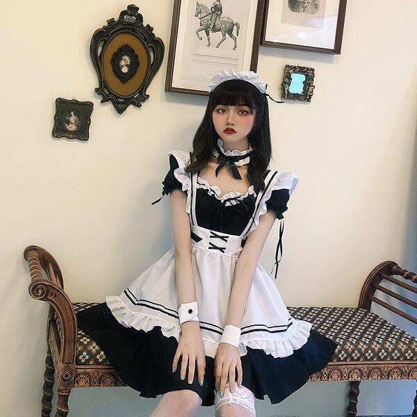 A stylish lolita maid dress featuring black and white colors with ruffles, perfect for cosplay or fashion.