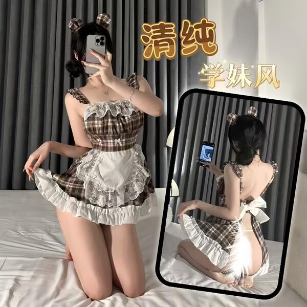 A person wearing a plaid maid costume dress with lace details, posing for a mirror selfie. the outfit features a playful desi...