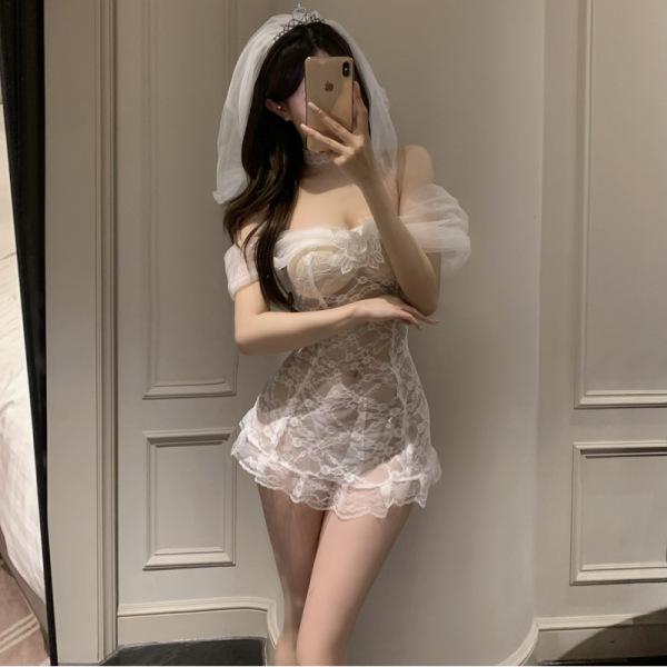 Woman in mirror wearing pure & playful lingerie set - sexy sheer bridal sleepwear with veil, romantic nightwear style.