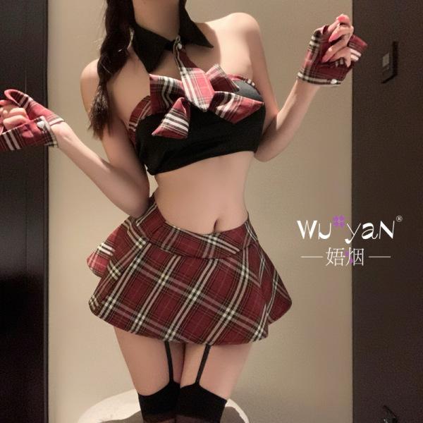 Woman wearing a red plaid jk uniform style lingerie set with a crop top, mini skirt, and thigh-high stockings.
