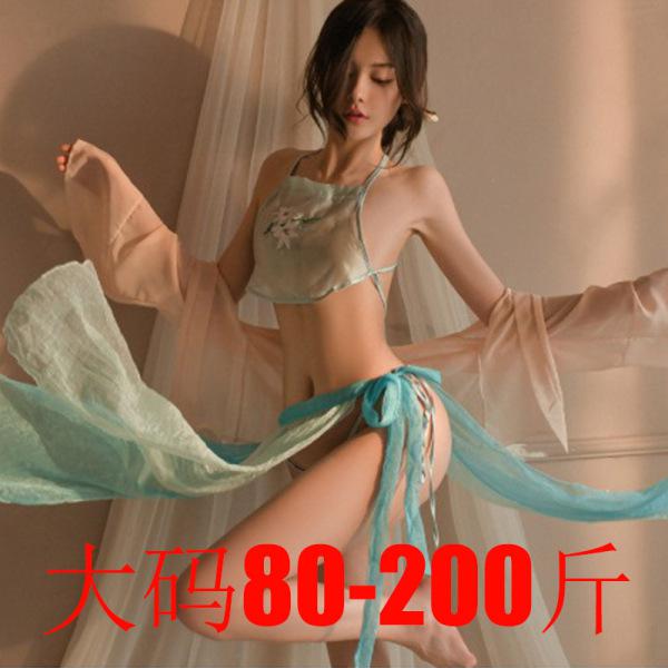 Woman wearing a sheer, light blue hanfu-inspired belly dance top and matching skirt with flowing sleeves, styled in a modern ...