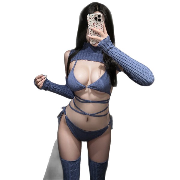 Woman modeling blue knit bralette and panty set with matching sleeves and thigh-highs, push-up enhancing lingerie.