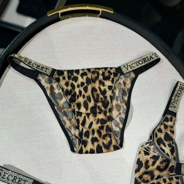 Leopard print ultra-thin ice silk thong yoga panties with secret branding, featuring breathable design and gusset for comfort...