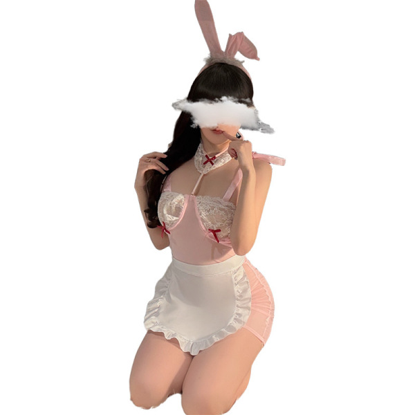Woman in pink bunny ears and sheer maid outfit with lace details, posing seductively for role play lingerie set.