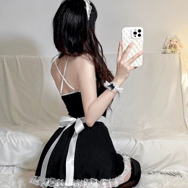 A stylish black maid dress with lace details and a white bow, perfect for cosplay or sleepwear. includes matching lingerie se...