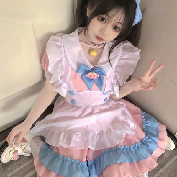 Soft pink and blue lolita maid dress with ruffles, cute bow, and playful design perfect for cosplay or daily wear.