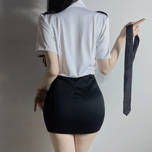 Woman wearing airu airu sexy flight attendant costume with white blouse and black skirt, holding a tie.
