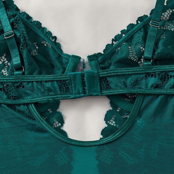 Close-up of green lace bodysuit back clasp and straps from amazons temptation lingerie set for women.