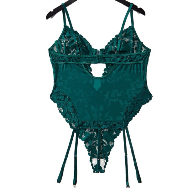 Emerald green lace bodysuit with open-crotch design and adjustable straps.