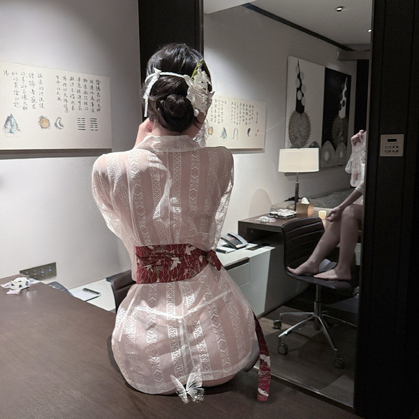A woman sits facing away from the camera, wearing an elegant ancient chinese hanfu robe set inspired by the qin-han dynasty. ...