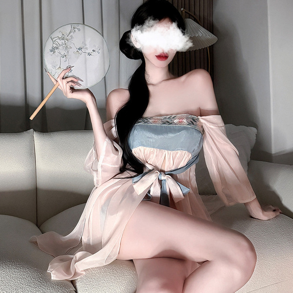 A woman poses elegantly in an ancient chinese style sheer chiffon hanfu dress, featuring a seductive palace-inspired design w...
