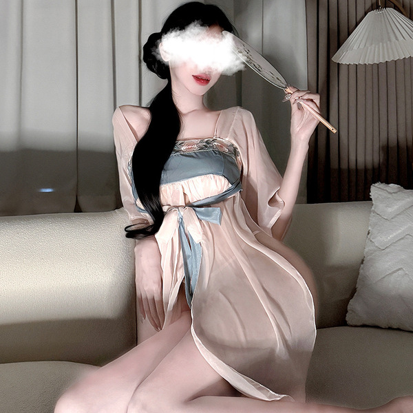A woman elegantly poses in an ancient chinese style sheer chiffon hanfu dress, featuring a seductive palace-inspired design w...