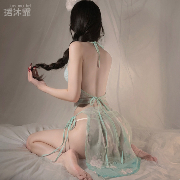 A woman poses in an elegant ancient chinese style silk belly band bodysuit, featuring sheer fabric and delicate design detail...