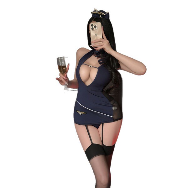 Woman in navy avian moon sheer airline-themed bodycon skirt set with garter straps, holding champagne and phone.