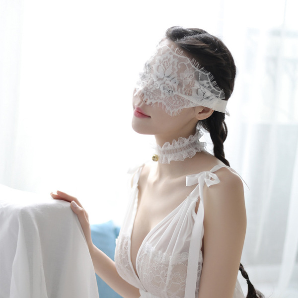Elegant white lace eye mask with delicate design, perfect for sensual sleep or roleplay accessories.