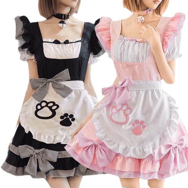 Two women wearing black and white cat girl cosplay costumes, featuring maid outfits with paw prints and ruffled details.