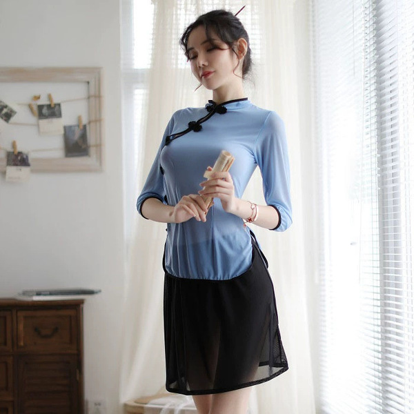 A woman elegantly poses in a blue lace cheongsam, featuring a sheer silk blend design, perfect for vintage-inspired roleplay ...