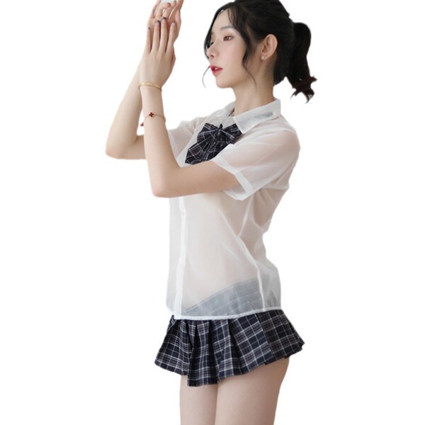 Woman modeling sheer white jk uniform top with bow and pleated plaid skirt from british-style lace teddy set.