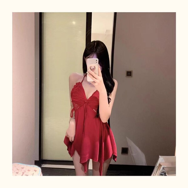 Woman wearing red butterfly lace sleeveless sleep dress with bow detail and sheer back, spring romantic lingerie set.