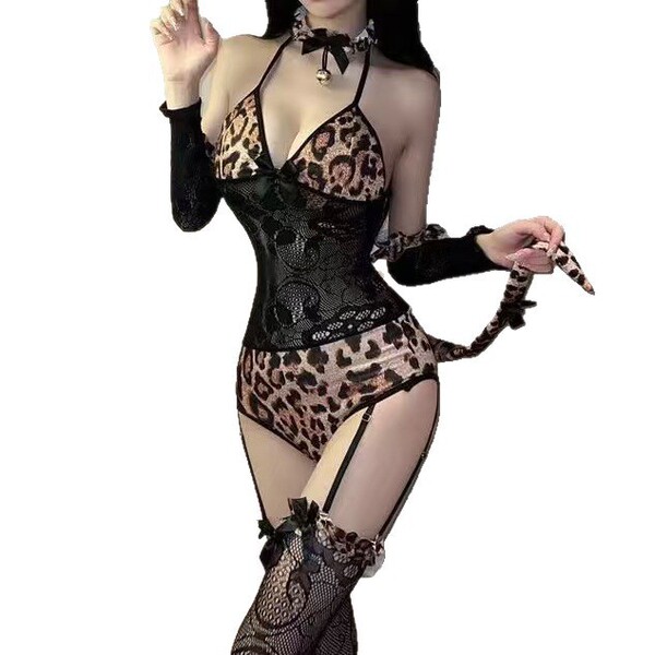 Woman wearing sexy leopard print catwoman bodysuit costume with lace details, choker, and thigh-high stockings for role play.