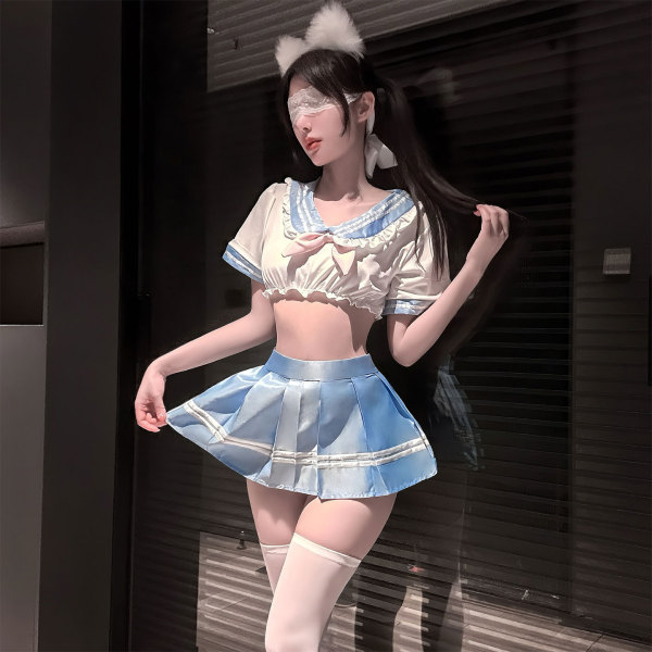 Woman wearing chao mu pure sailor-style lingerie set with flirty pleated skirt, white top, cat ears, and thigh-highs in a dim...