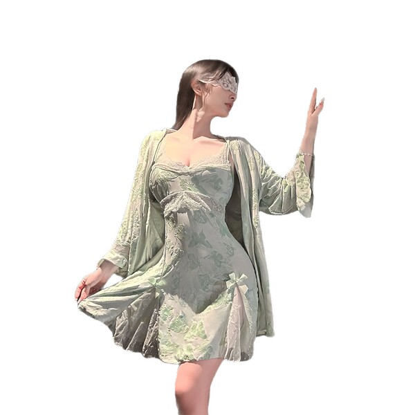 Woman wearing chaomu lace print lingerie set with sheer cami, matching briefs, and elegant robe in soft green.
