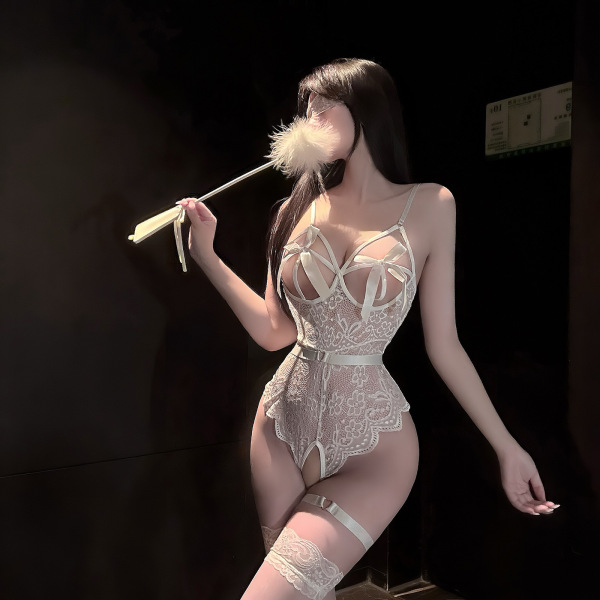 Woman in chaomu sensual lingerie – pure-yet-alluring lace erotic set with sheer stockings & insertable design, holding a feat...