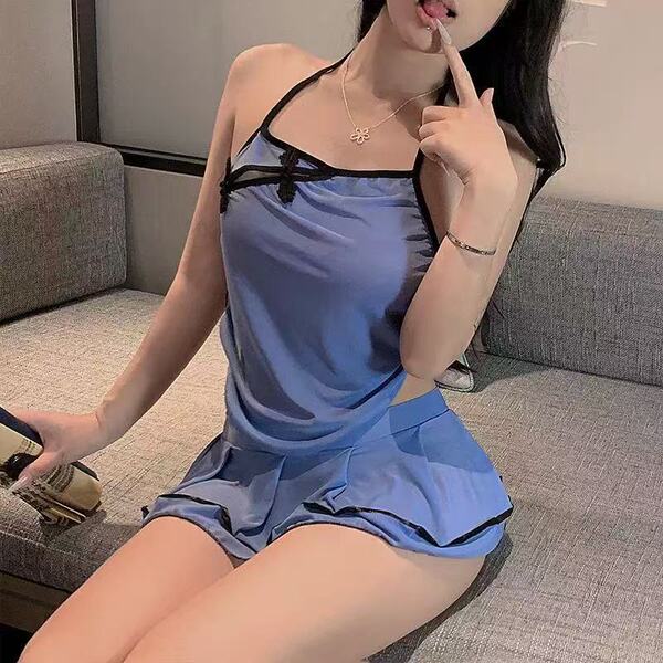 Woman wearing blue cherry blossom lingerie set with sheer side-slit cheongsam-style dress, vintage-inspired and seductive yet...