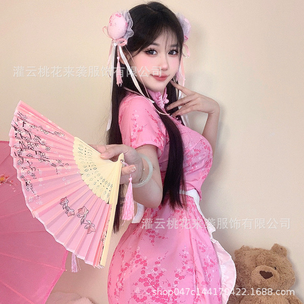 A woman wearing a pink chinese-inspired qipao dress, holding a matching fan, posing elegantly. perfect for cosplay or role pl...