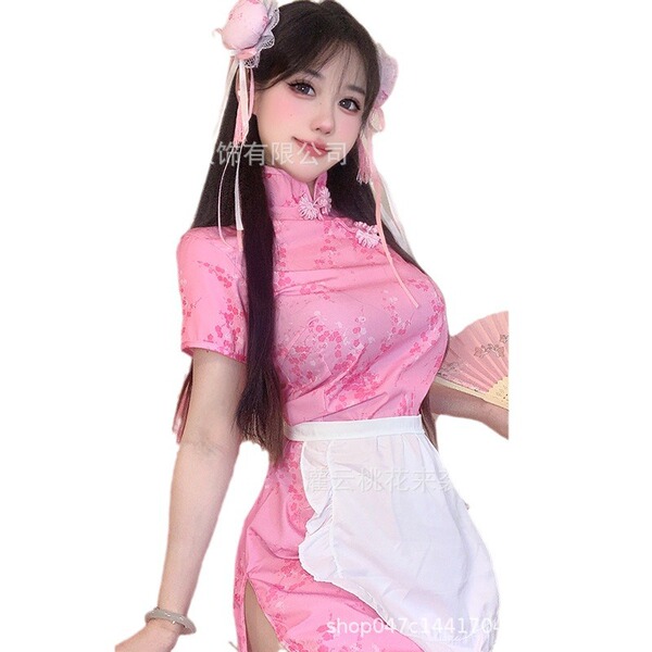 A woman wearing a pink chinese-inspired maid costume, featuring a qipao top with floral patterns and an open-crotch design, p...