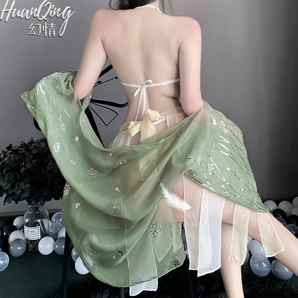 A woman wears a vintage floral lace chemise set with a sheer green shawl, featuring a seductive no-remove design.