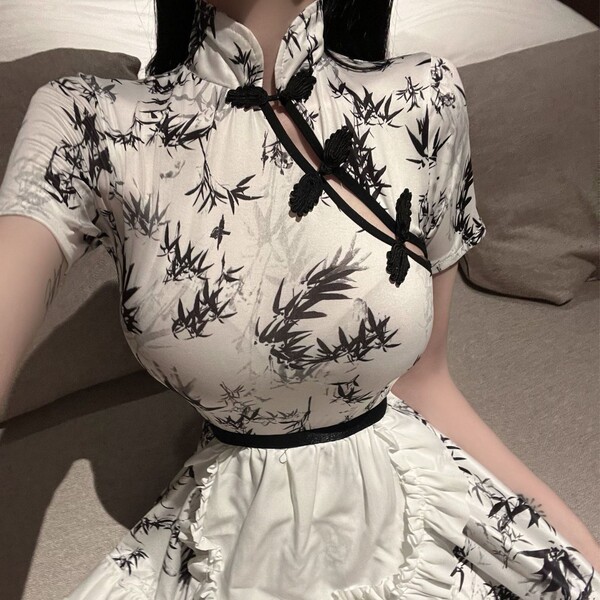 A stylish white dress featuring a bamboo print, perfect for live streaming and photoshoots. its inspired by traditional chine...