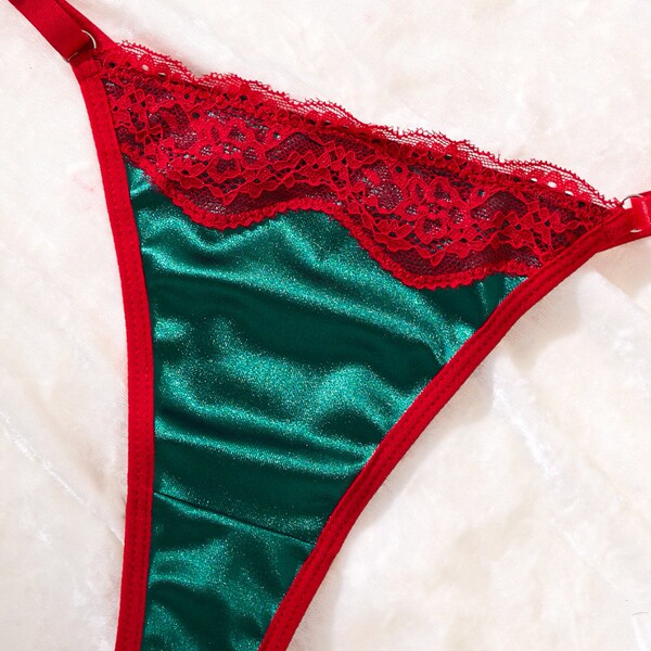 Christmas red and green lace thong with satin finish, part of a festive european-style lingerie set for women.